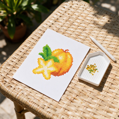Fruit Punch diamond painting kit: star fruit canvas on a rattan patio table
