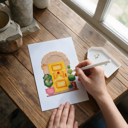Secret Garden diamond painting kit: yellow cottage door canvas on a farmhouse table