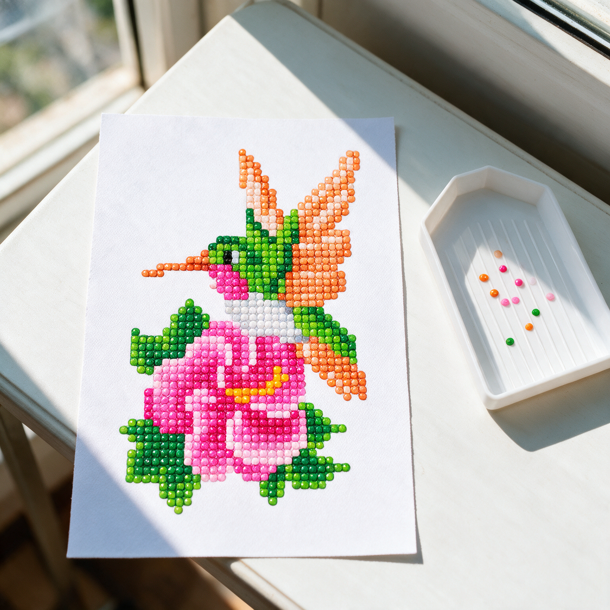 Tropical Flock diamond painting kit: hummingbird canvas in a sunroom